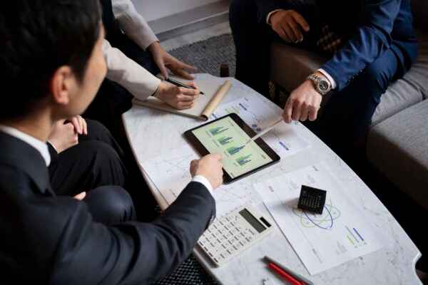 business-people-working-with-ipad-high-angle